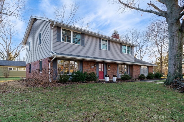 front facade with a front yard