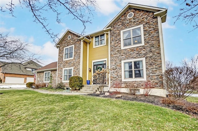 view of front property featuring a garage and a front yard