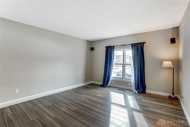 unfurnished room featuring wood-type flooring