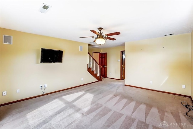 carpeted empty room with ceiling fan