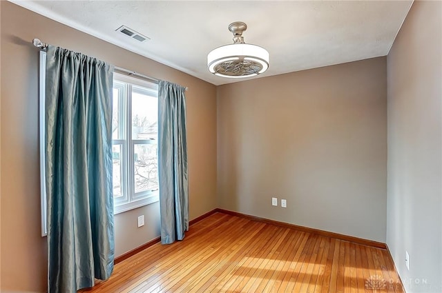 unfurnished room featuring light hardwood / wood-style flooring