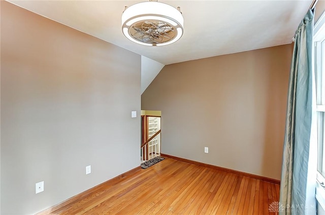 interior space with vaulted ceiling and light hardwood / wood-style floors