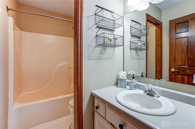 full bathroom featuring vanity, shower / bathtub combination, and toilet