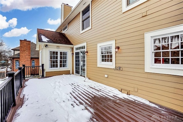 view of snow covered deck