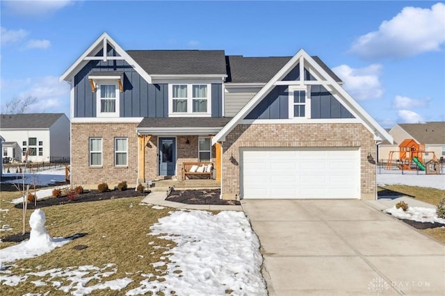 view of front of house with brick siding, a playground, an attached garage, board and batten siding, and driveway