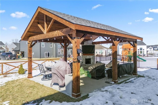 exterior space with a residential view, fence, and a gazebo