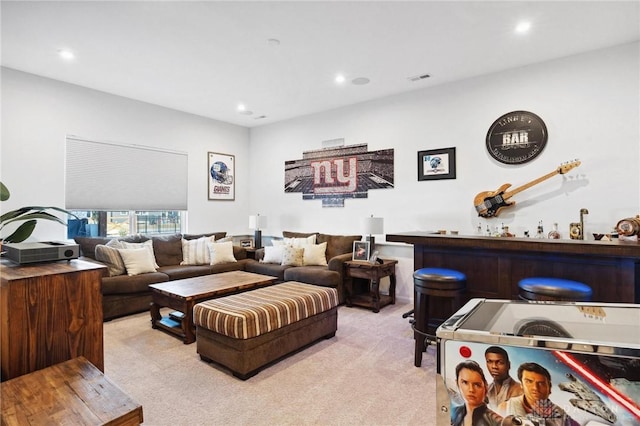 living room featuring light colored carpet and bar area