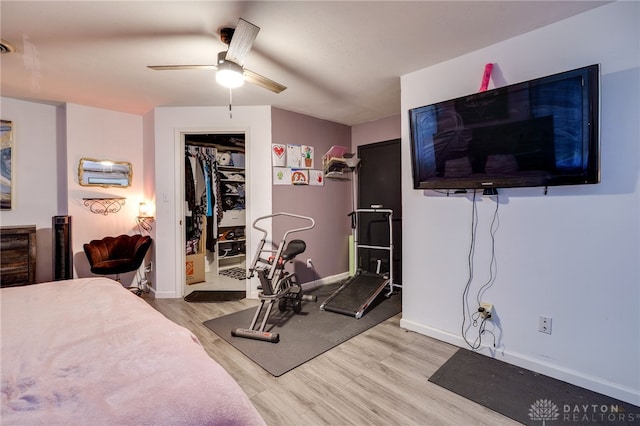 bedroom with ceiling fan and light hardwood / wood-style flooring