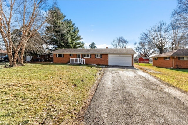 single story home with a garage and a front yard