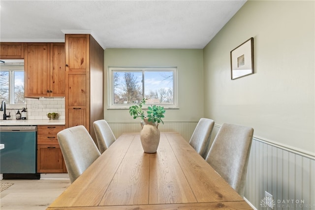 dining space featuring a healthy amount of sunlight and light wood-type flooring