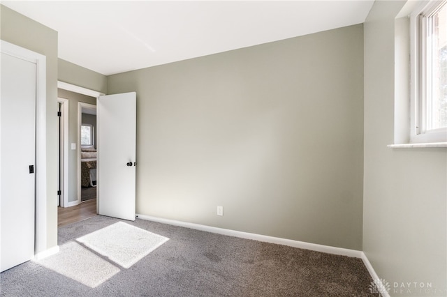 unfurnished bedroom featuring light colored carpet