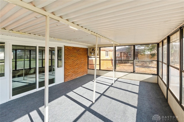 unfurnished sunroom featuring a wealth of natural light