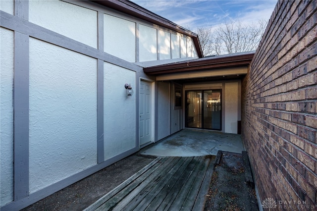 property entrance featuring a patio area