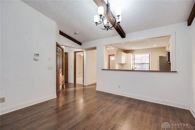 unfurnished living room featuring beam ceiling, hardwood / wood-style flooring, a chandelier, and a textured ceiling