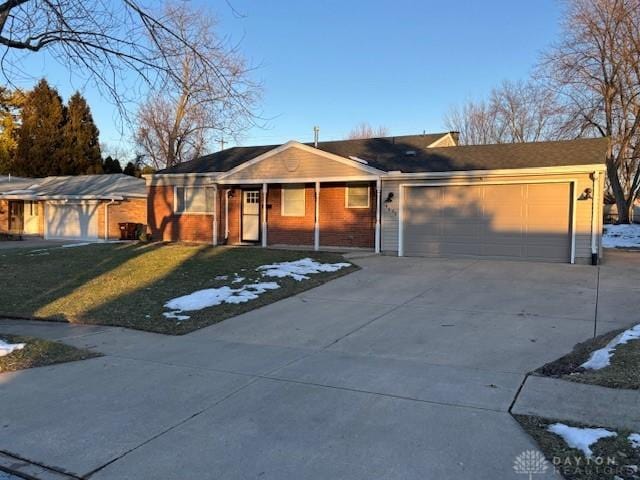 single story home featuring a garage and a front yard