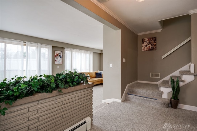 carpeted foyer with ornamental molding and a baseboard heating unit