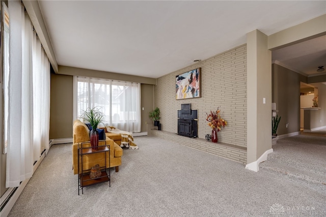 living room featuring light colored carpet, brick wall, and a wood stove