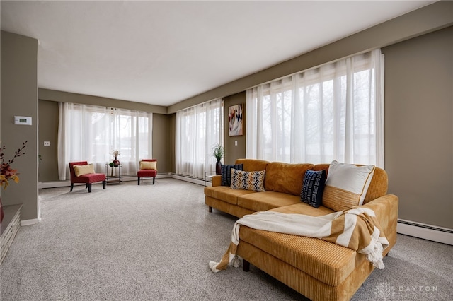 carpeted living room with a baseboard radiator