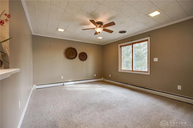 spare room featuring a baseboard heating unit, crown molding, ceiling fan, and carpet flooring