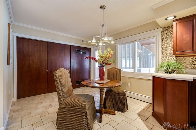 dining area featuring a baseboard radiator, ornamental molding, and a chandelier