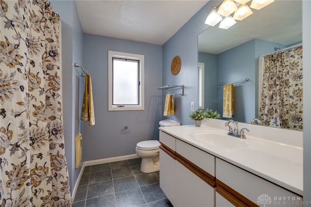 bathroom featuring vanity, walk in shower, tile patterned floors, and toilet