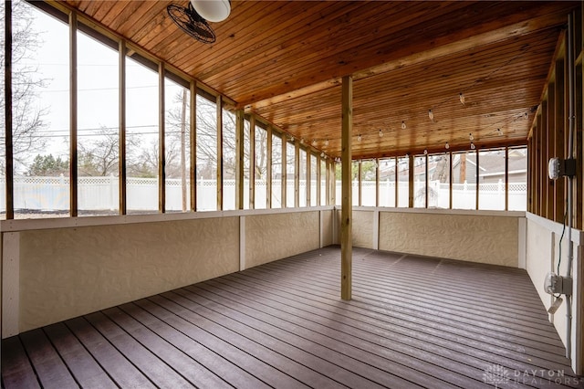 unfurnished sunroom with wooden ceiling