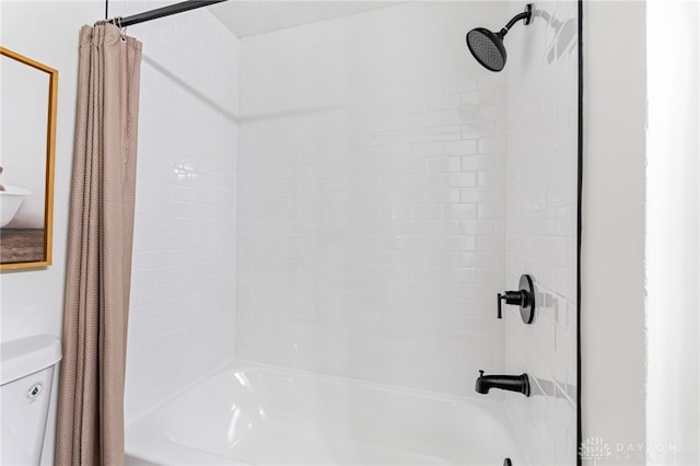 bathroom with shower / tub combo with curtain and toilet