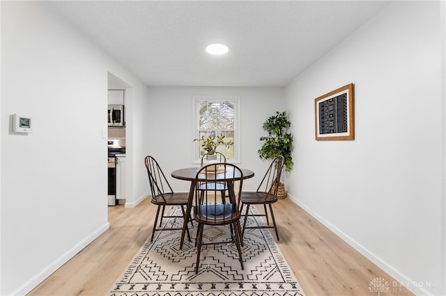 dining room featuring light hardwood / wood-style flooring