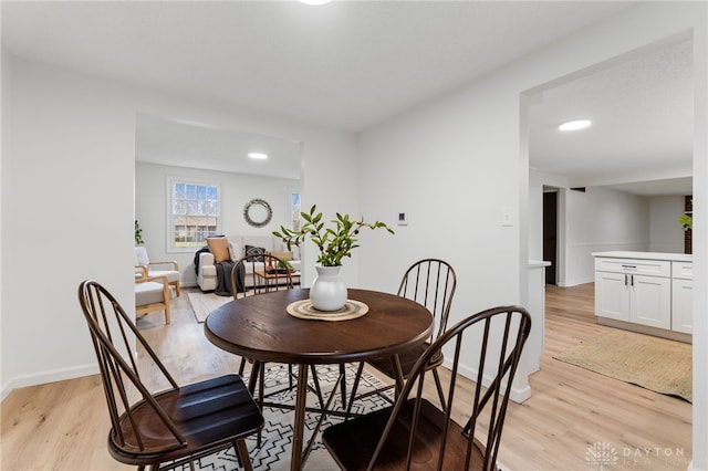 dining space featuring light hardwood / wood-style flooring