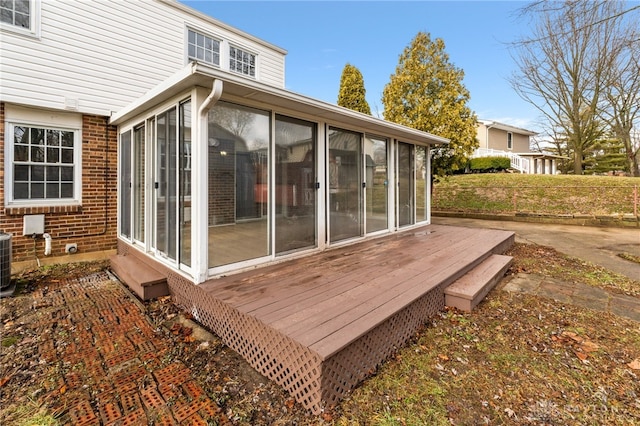 wooden terrace with a sunroom