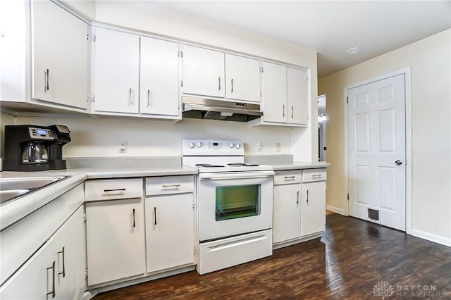 kitchen featuring dark wood-type flooring, white electric range oven, and white cabinets