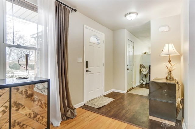 foyer entrance with hardwood / wood-style floors