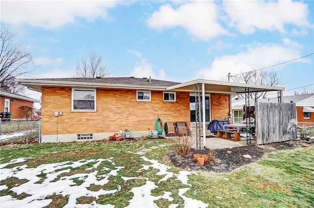 rear view of property featuring a patio area