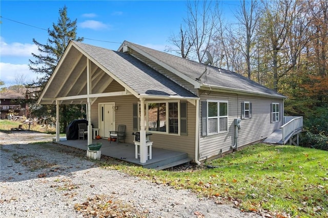 view of front of property with a patio and a front yard