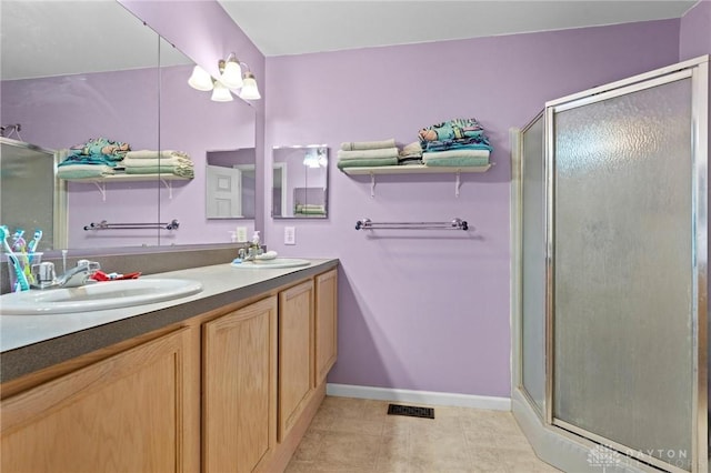 bathroom with vanity and an enclosed shower