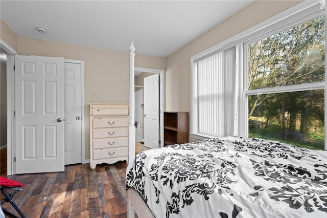 bedroom with dark hardwood / wood-style floors