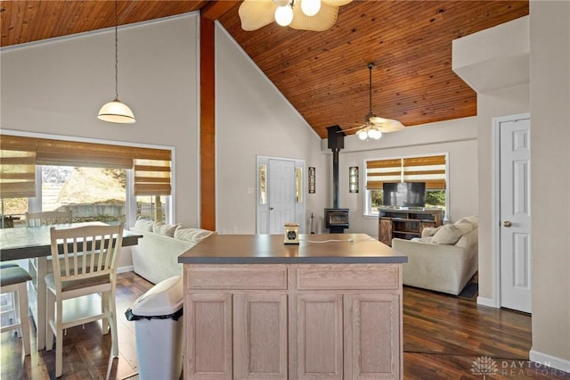 kitchen featuring pendant lighting, high vaulted ceiling, dark hardwood / wood-style floors, light brown cabinetry, and wooden ceiling