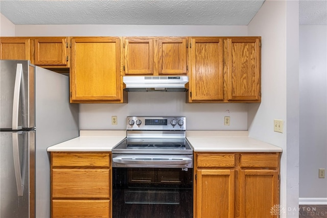 kitchen with stainless steel appliances and a textured ceiling