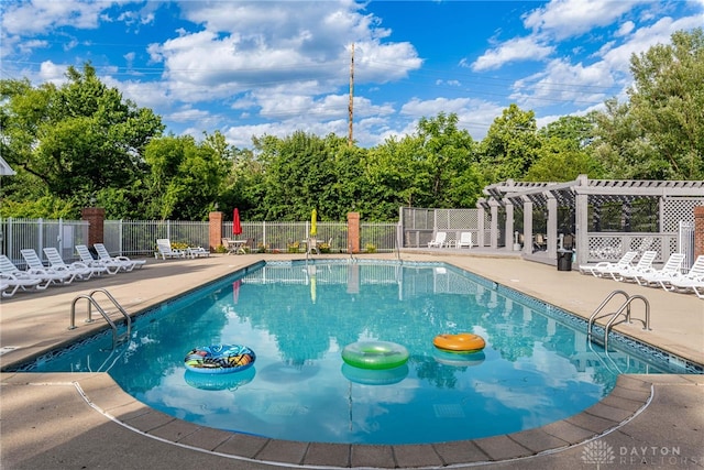 view of pool featuring a patio and a pergola