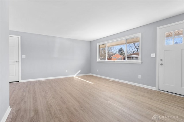 foyer entrance with light hardwood / wood-style flooring