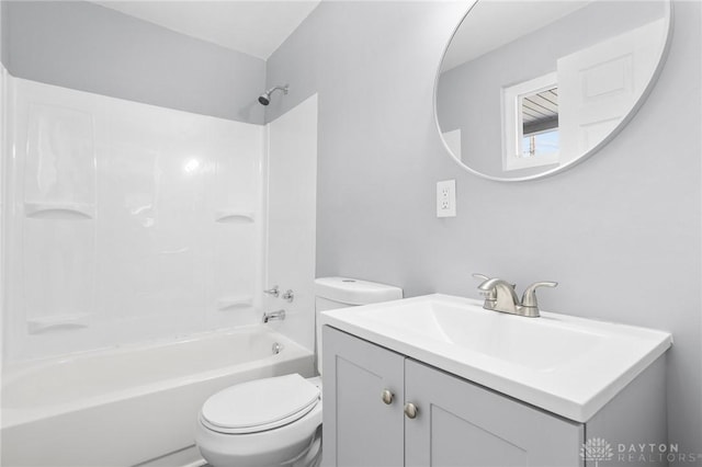 full bathroom featuring shower / bathtub combination, vanity, and toilet