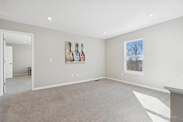 empty room with light colored carpet