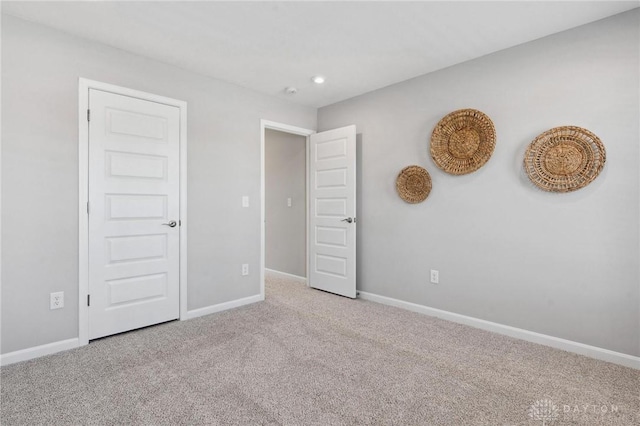 unfurnished bedroom with carpet flooring