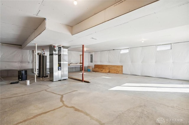 basement with water heater, heating unit, and electric panel