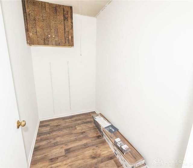 unfurnished room with dark hardwood / wood-style floors