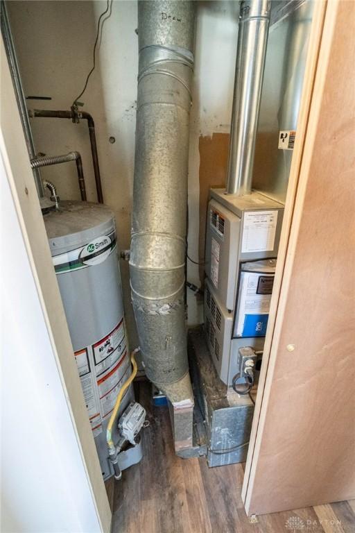 utility room with water heater