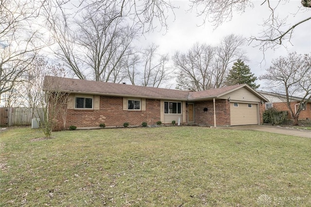 ranch-style house with a garage, a front lawn, and central air condition unit