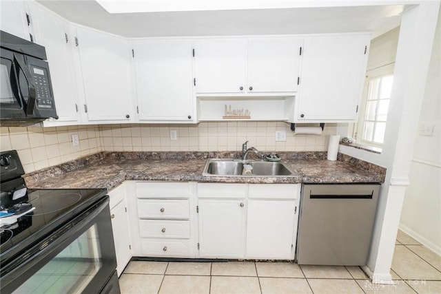 kitchen featuring light tile patterned flooring, sink, tasteful backsplash, black appliances, and white cabinets