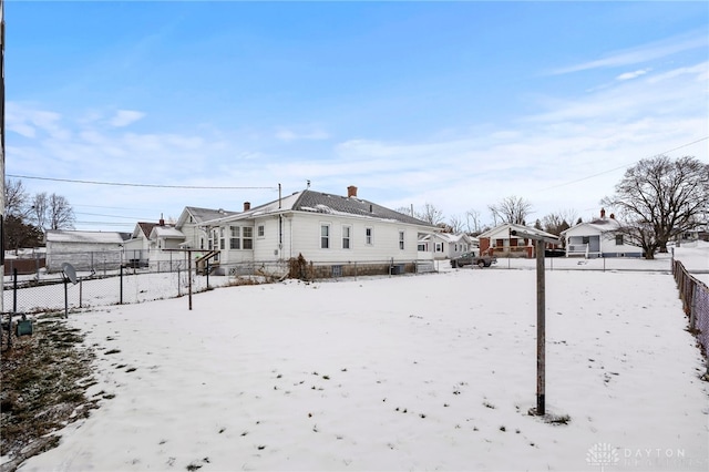 view of snow covered house