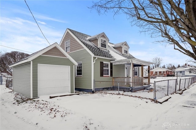 view of front of house featuring a garage and a porch